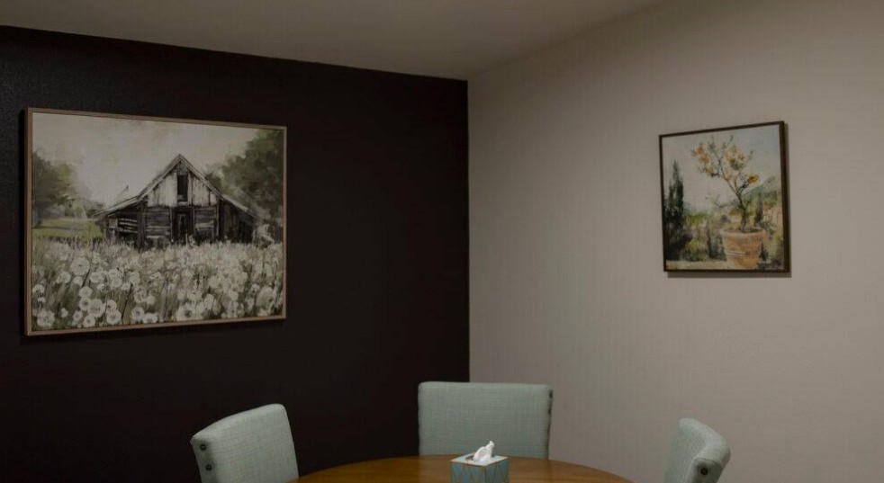 Private consultation room with round table and chairs