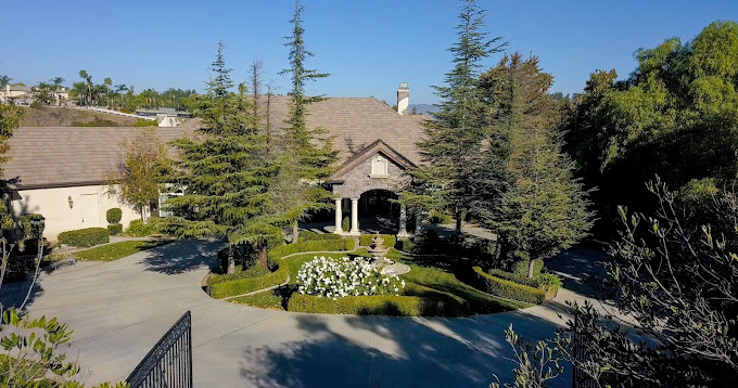 Aerial view of driveway and main residential facility