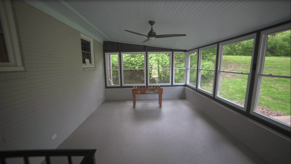 Game room with football table and large windows
