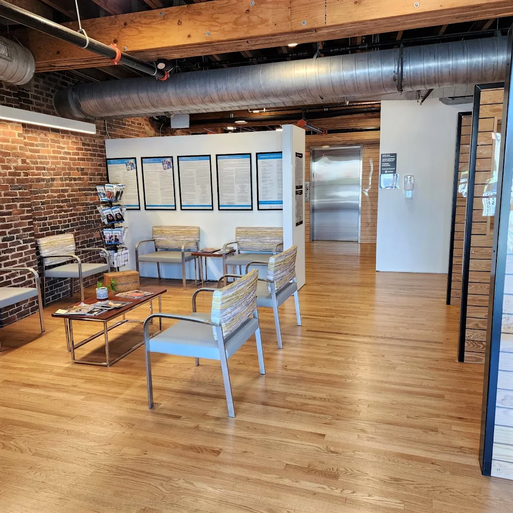 Patient waiting area with chairs and informational displays at Master Center Harrisonburg