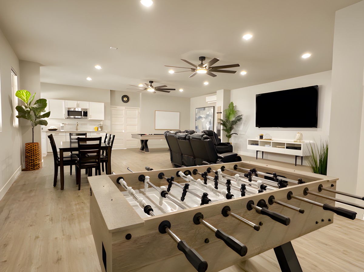 Recreation room with foosball table and theater seating