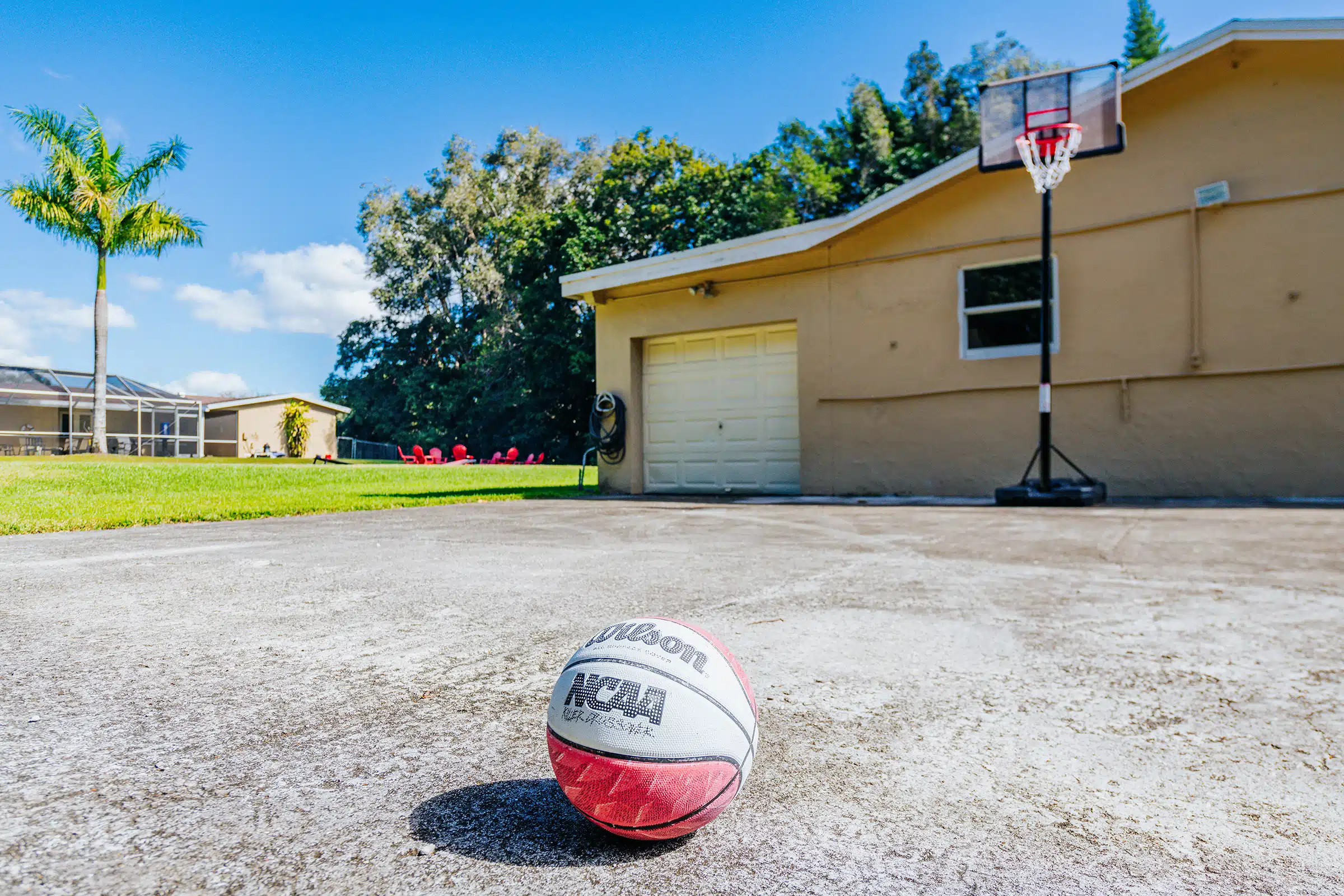 Outdoor hoop and basketball on a concrete court