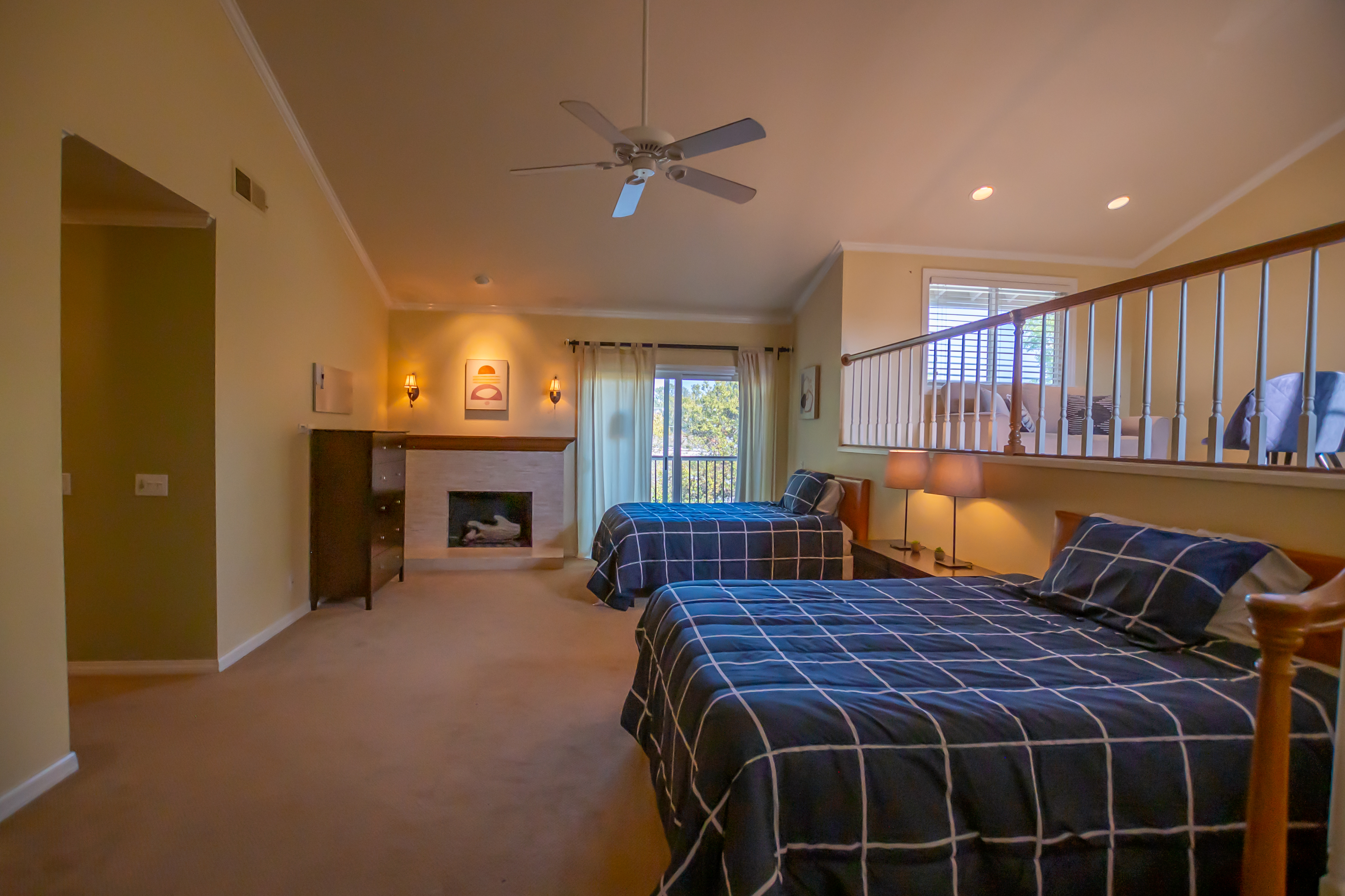 Bedroom suite with fireplace and seating area