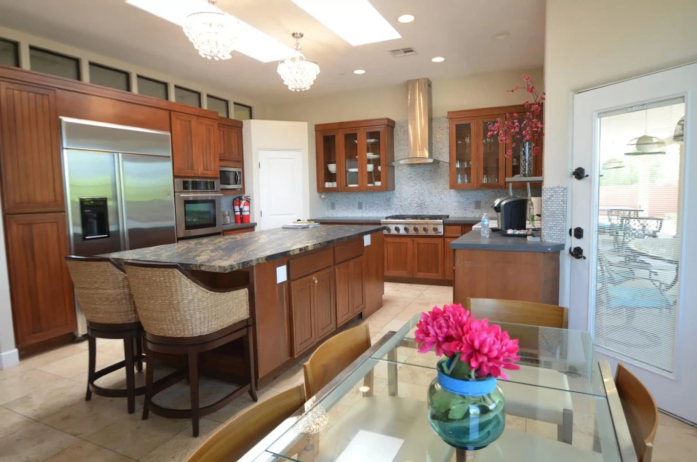 Kitchen with island and dining table seating