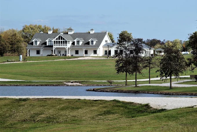 Rehab facility beside lake with green landscape
