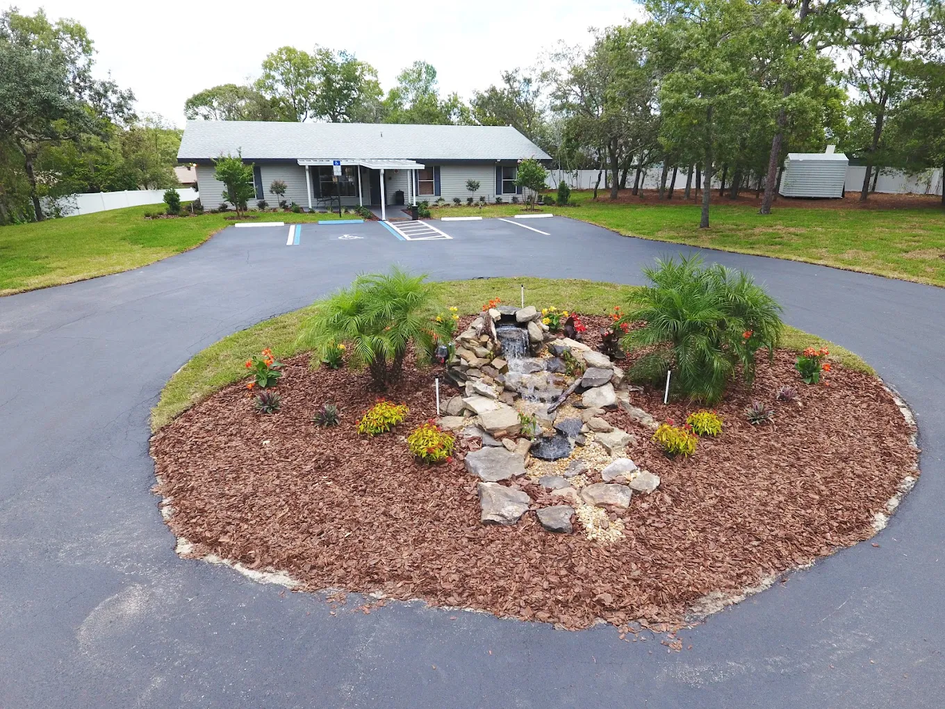 Circular driveway with landscaped fountain center