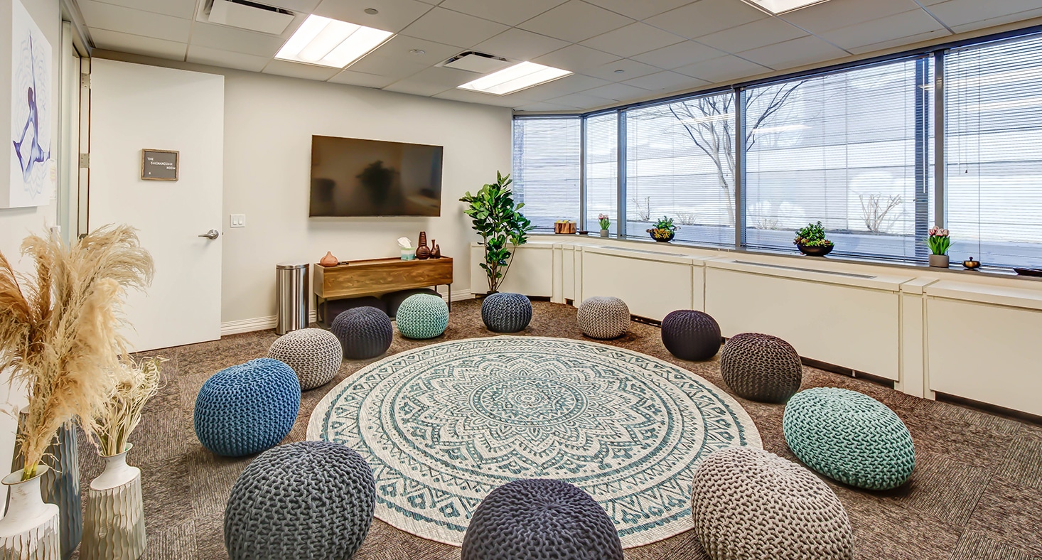 Mindfulness room with knitted poufs in a circle