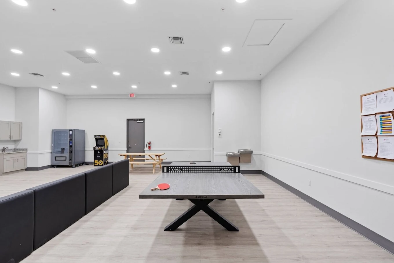 Spacious game area with ping pong table and lounge seating