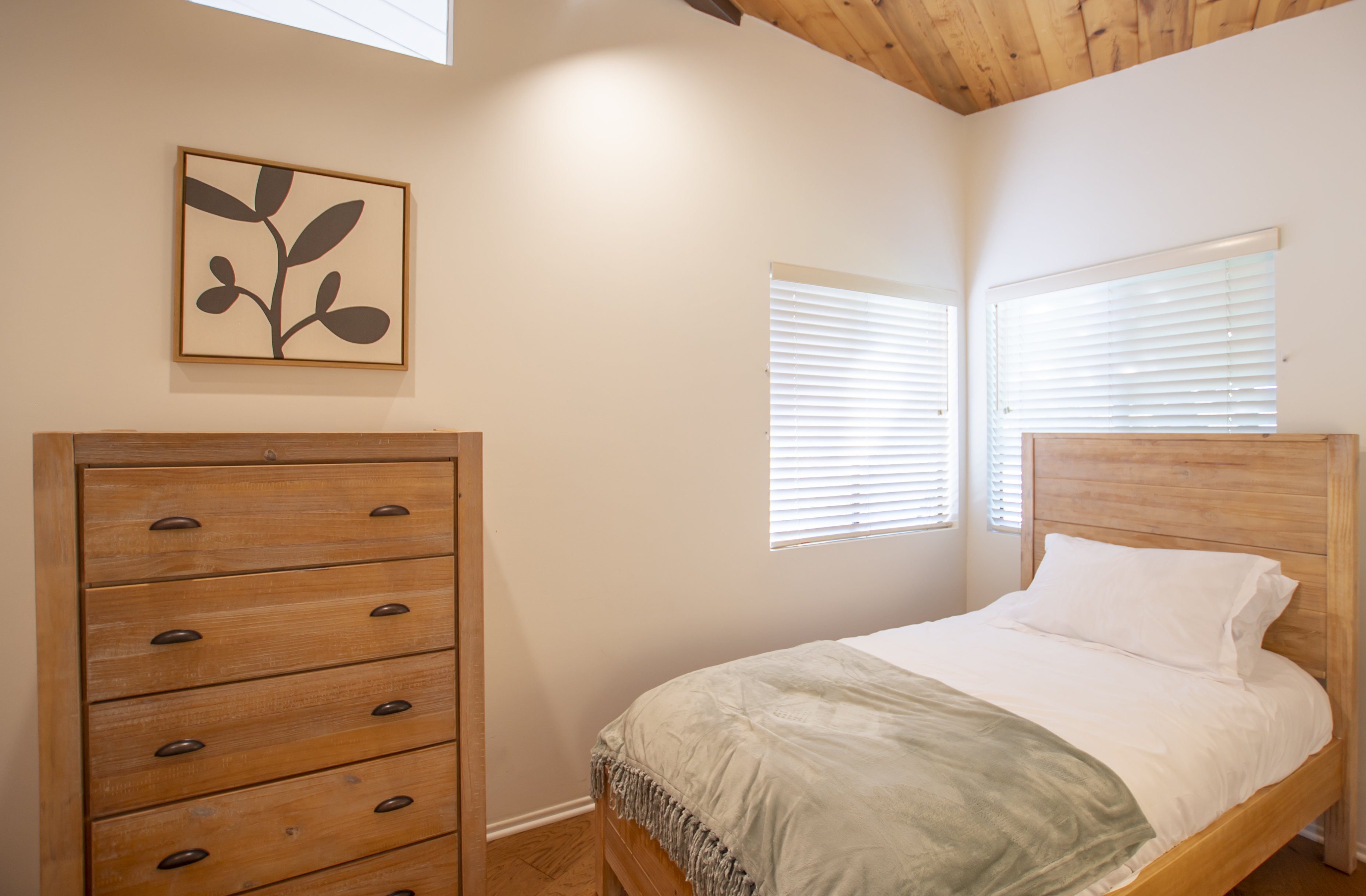 Simple bedroom with single bed and dresser