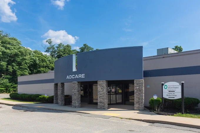 Clinic exterior with AdCare sign and entryway