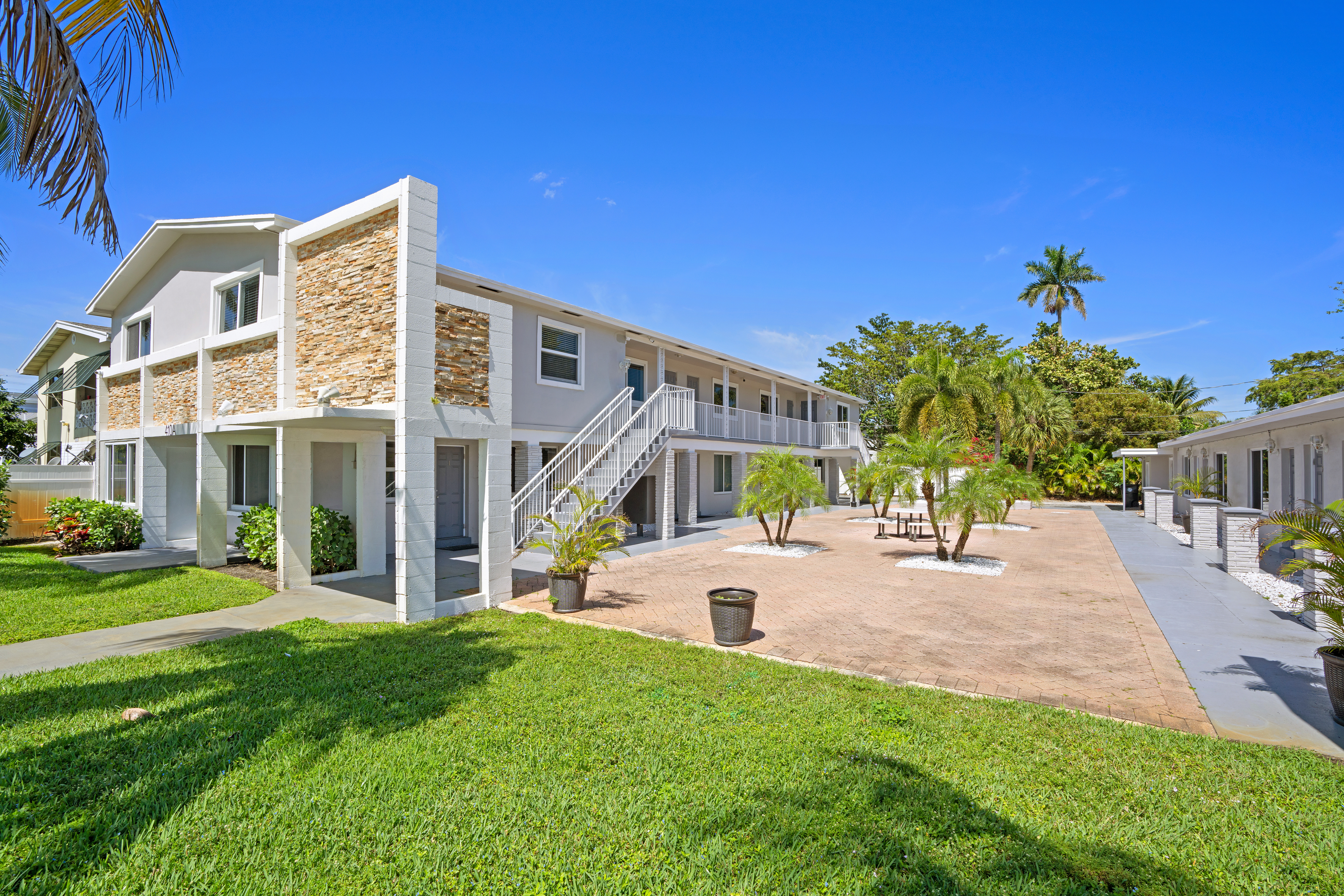 Exterior of double story building with grass and trees