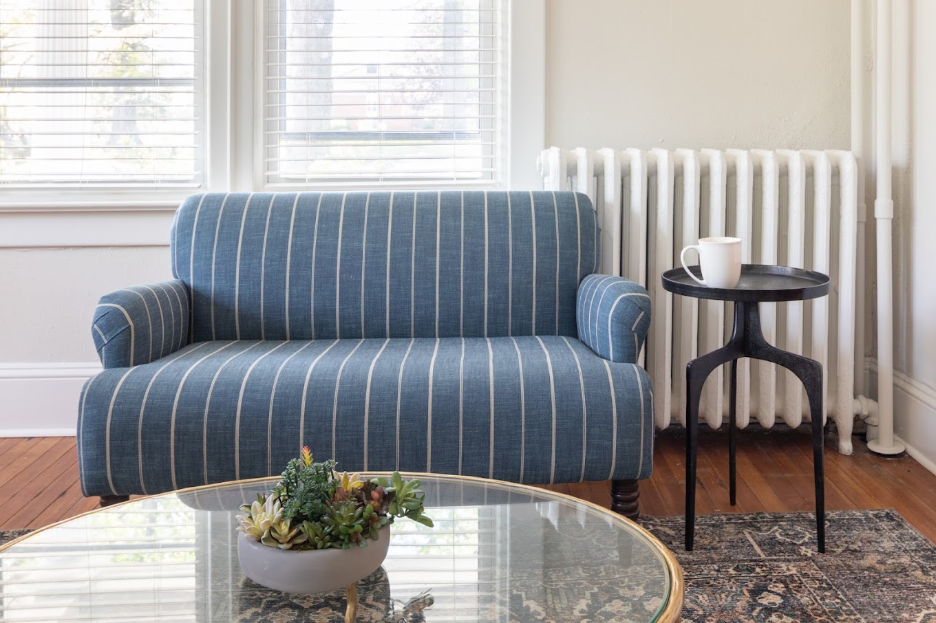 Sating area with a sofa and table.