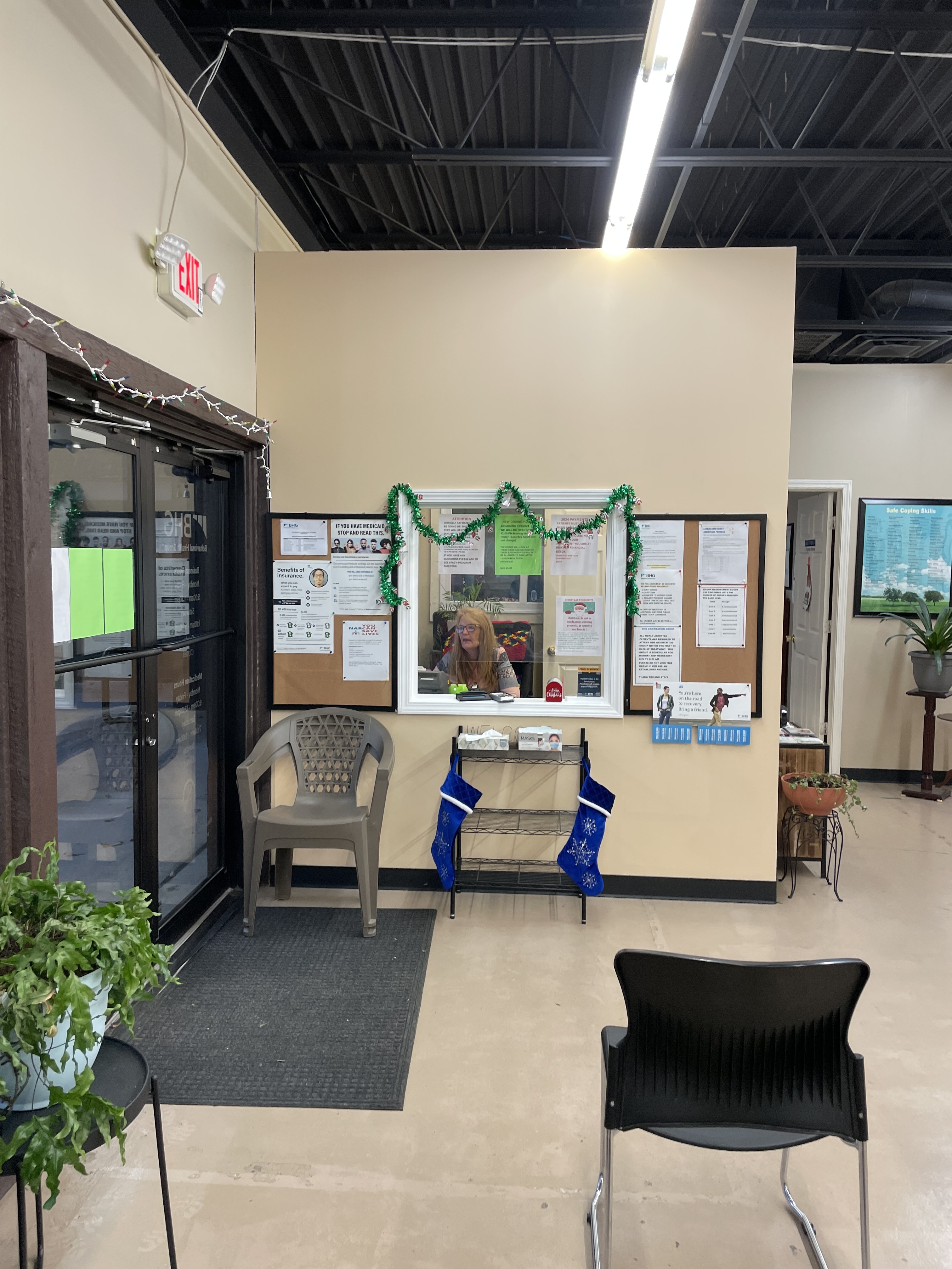 Lobby entrance with reception window and patient information