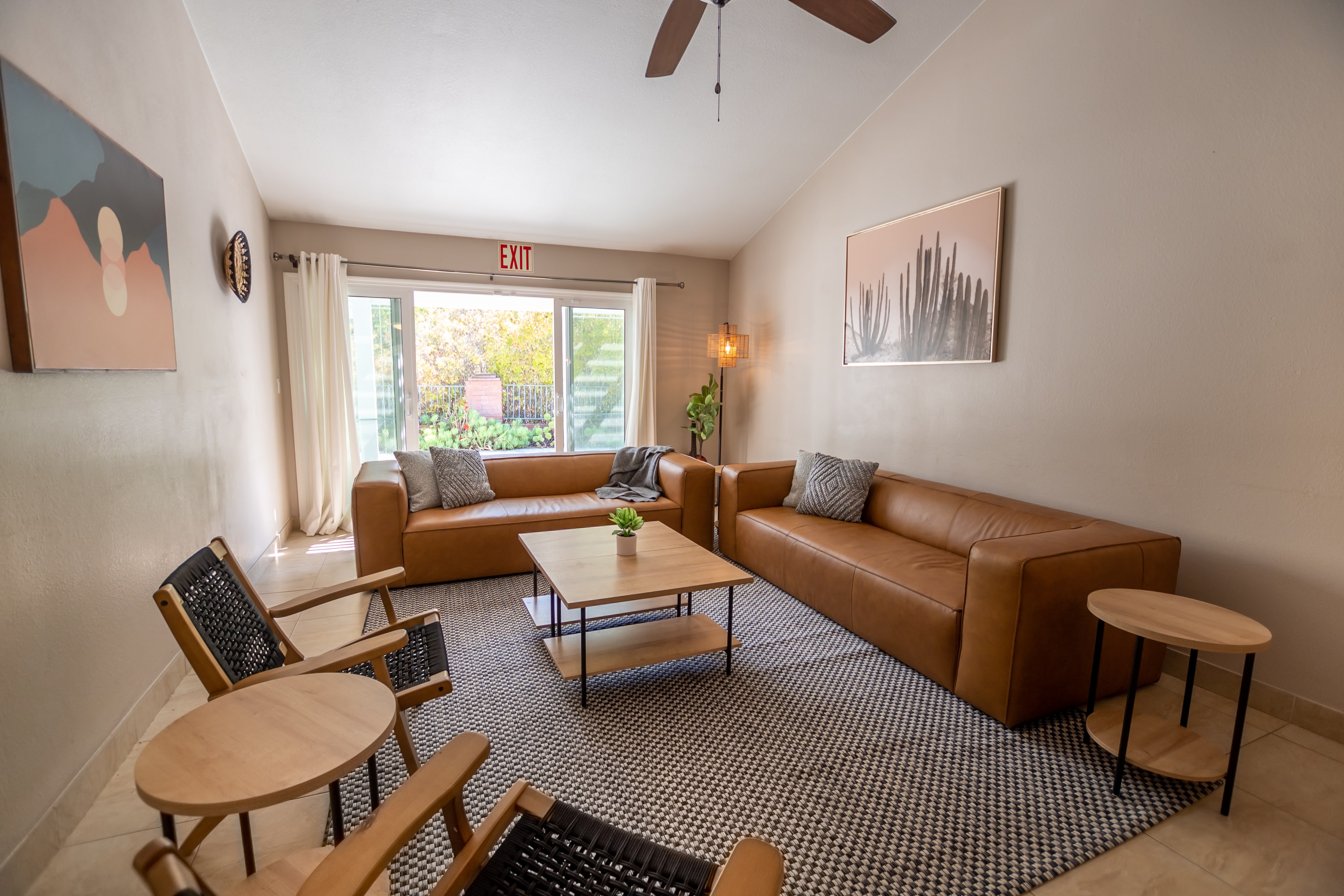 Two brown leather sofas in a cozy lounge area