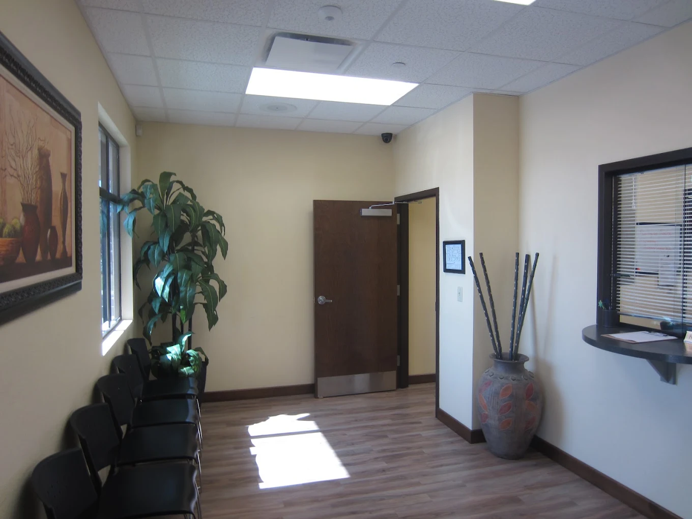 Lobby waiting area with seating and reception window