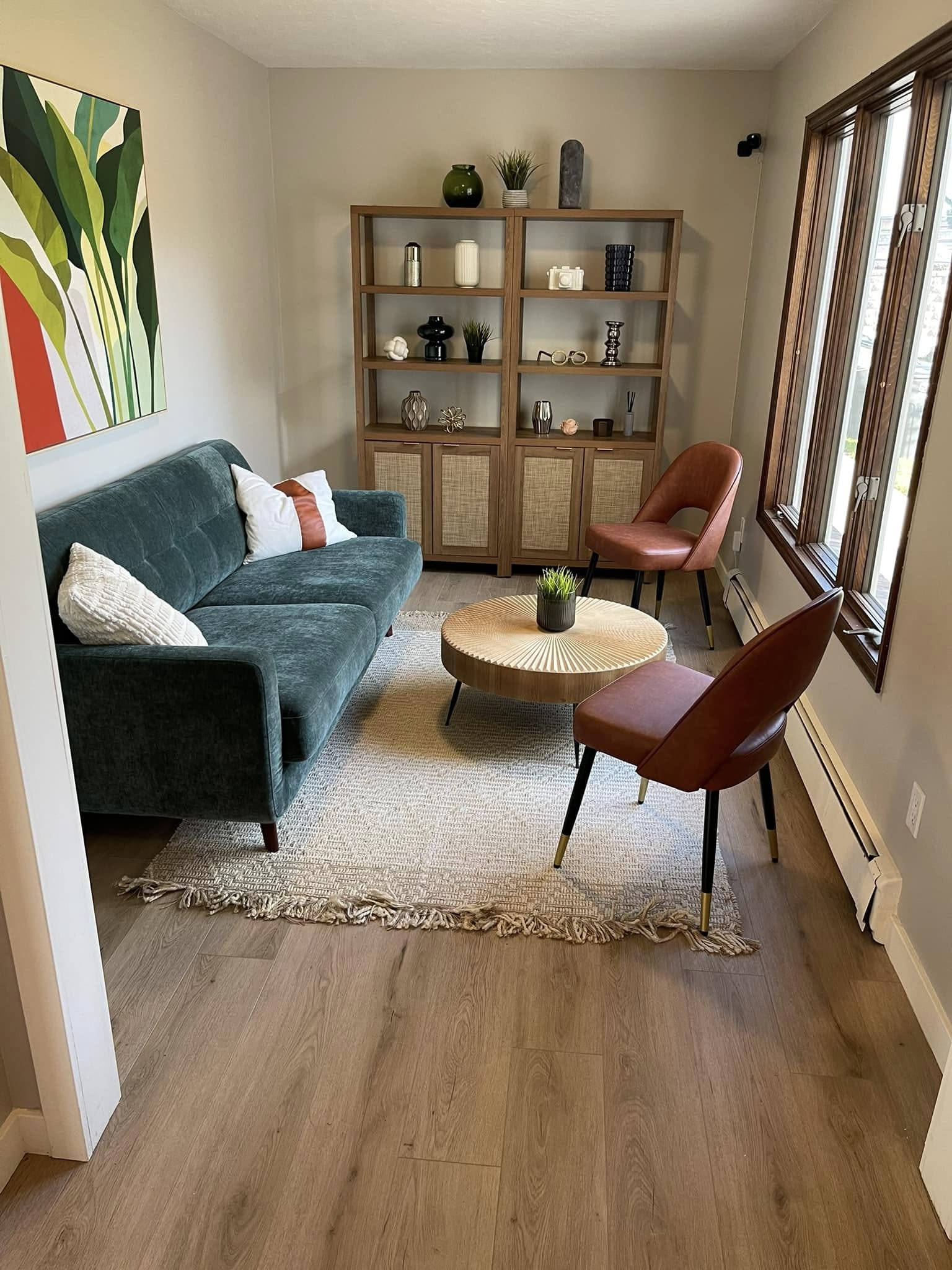 Small cozy lounge with bookshelf and window