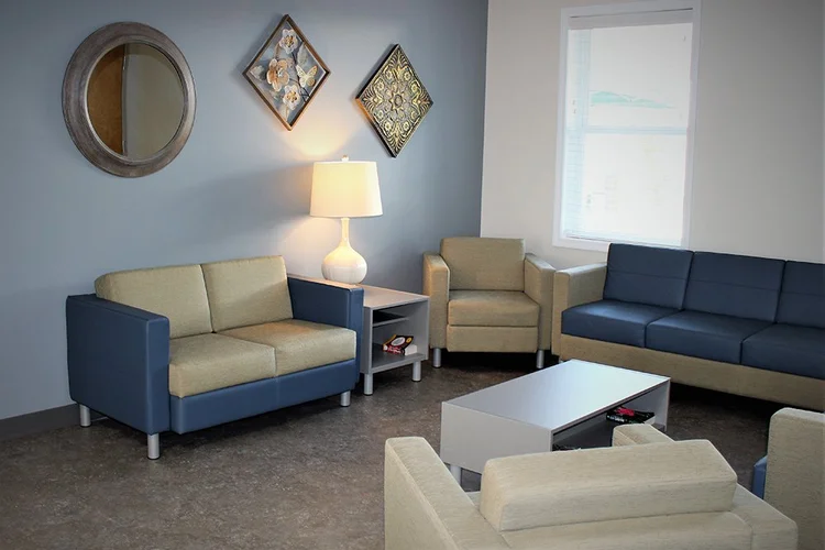 Waiting area with sofas and side tables