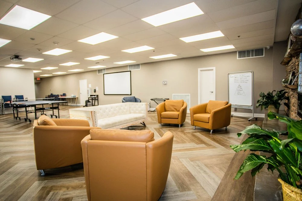 Lounge with leather chairs and whiteboard