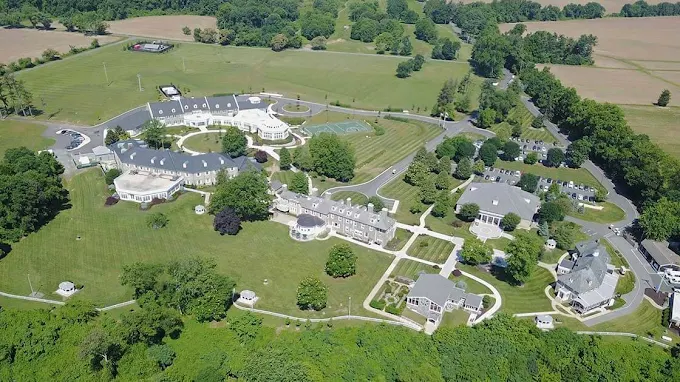 Aerial view of rehab campus surrounded by fields and trees