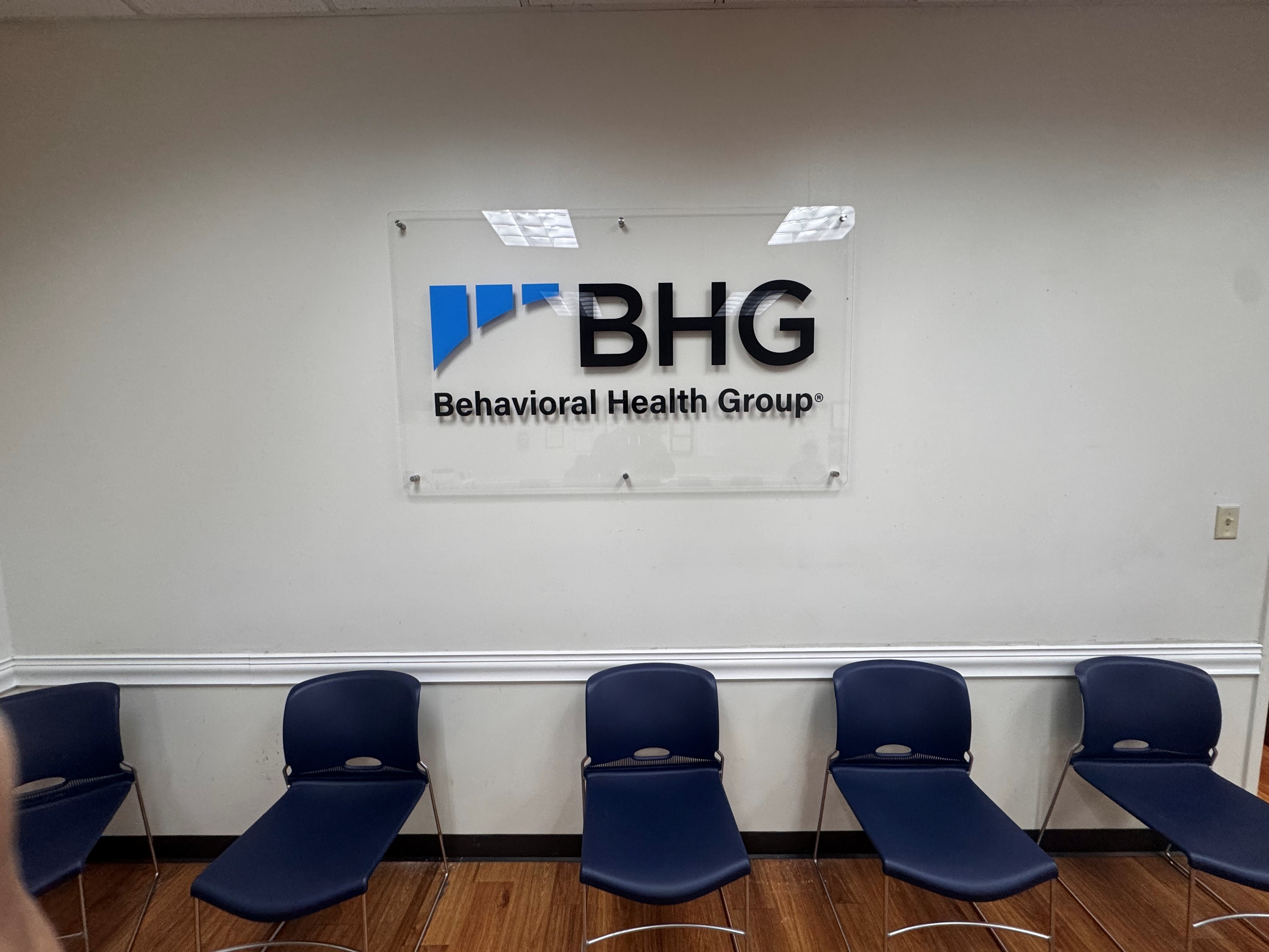 Waiting area with chairs and BHG wall sign