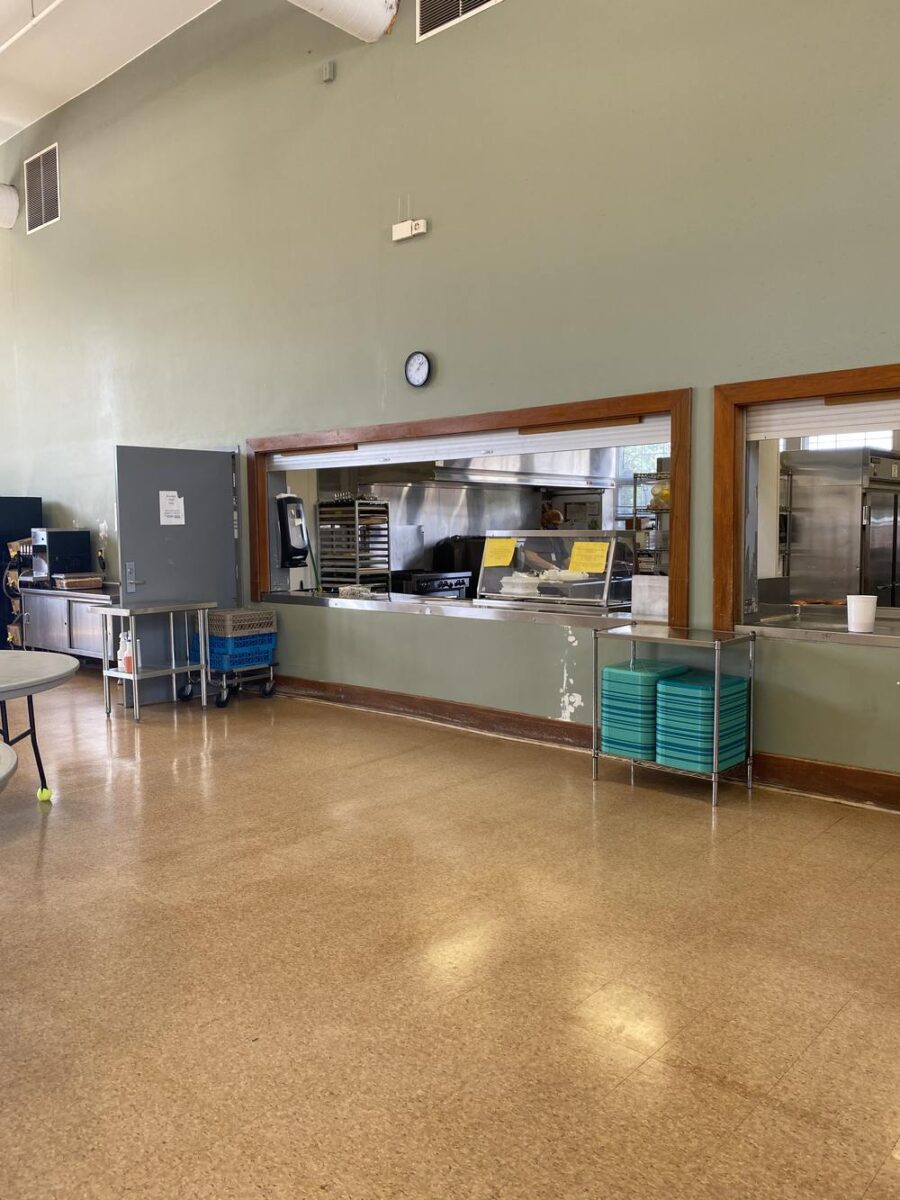 Serving window with kitchen view and stacked trays