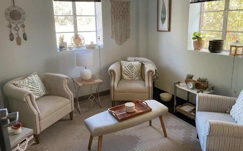 A tranquil therapy space with armchairs and soft lighting
