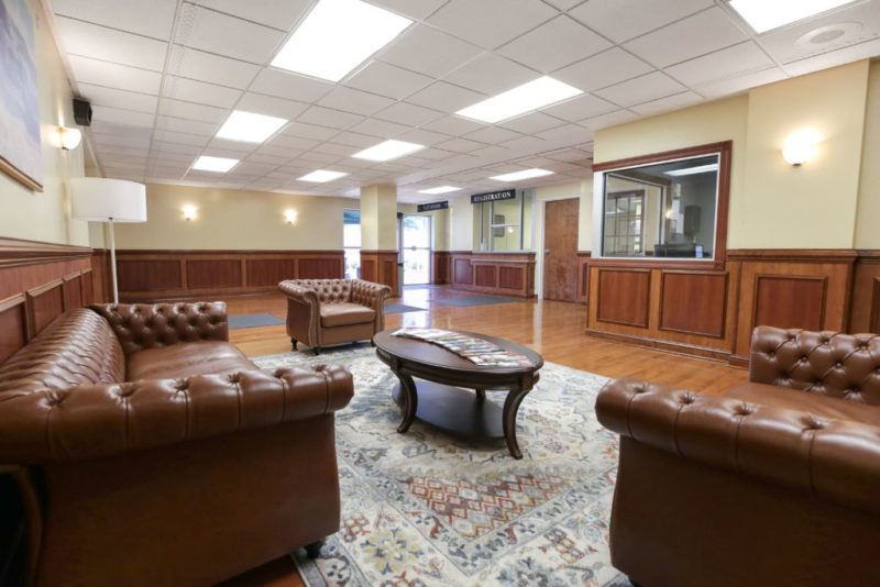 Lounge with leather chairs and check-in desk