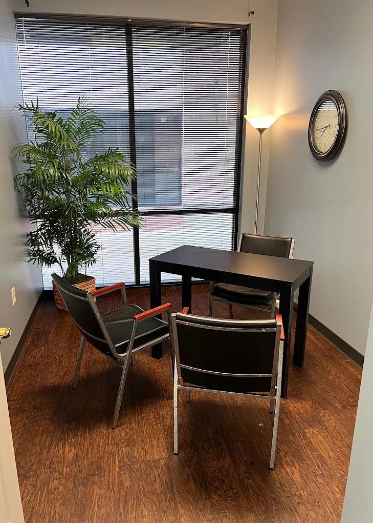 Small consultation room with table and chairs