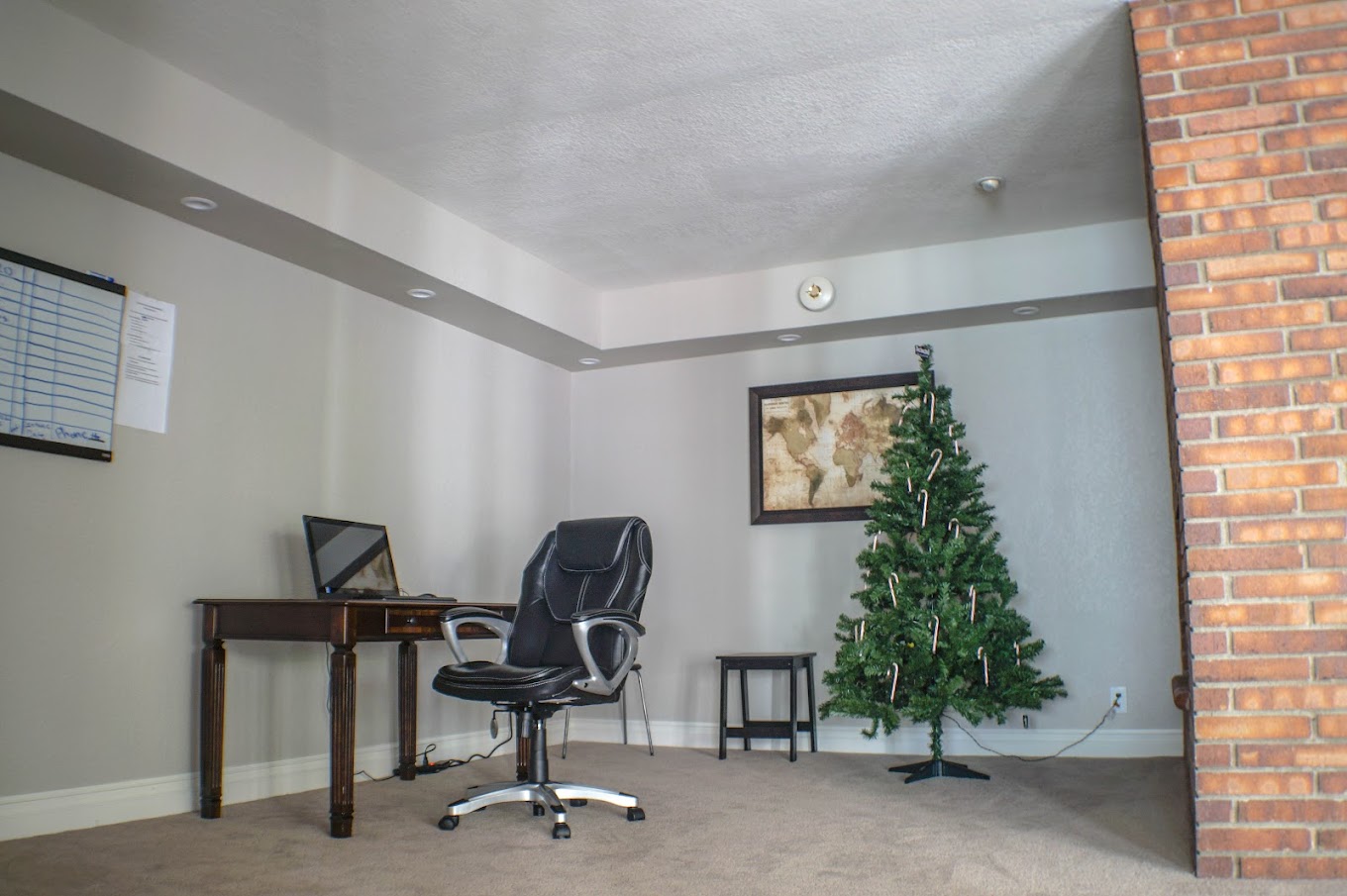 Therapy room with a desk and chair.