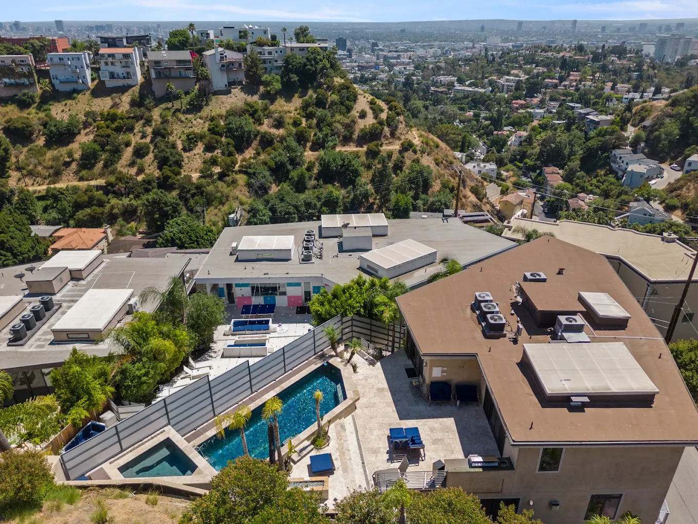 Aerial view of Ritz Recovery located in the hills of Los Angeles with a panoramic city skyline in the background