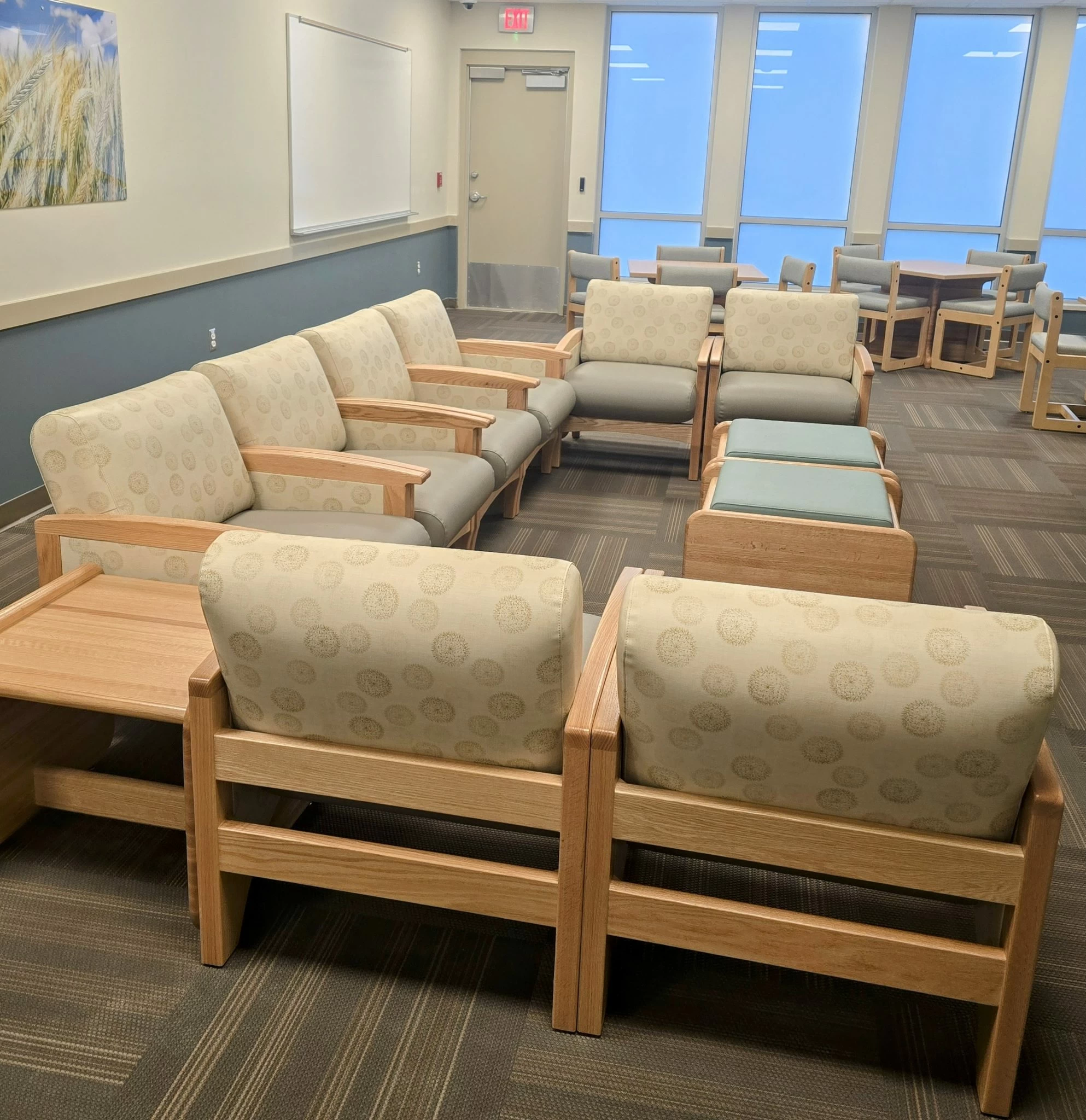 Resident common area with lounge seating and activity tables