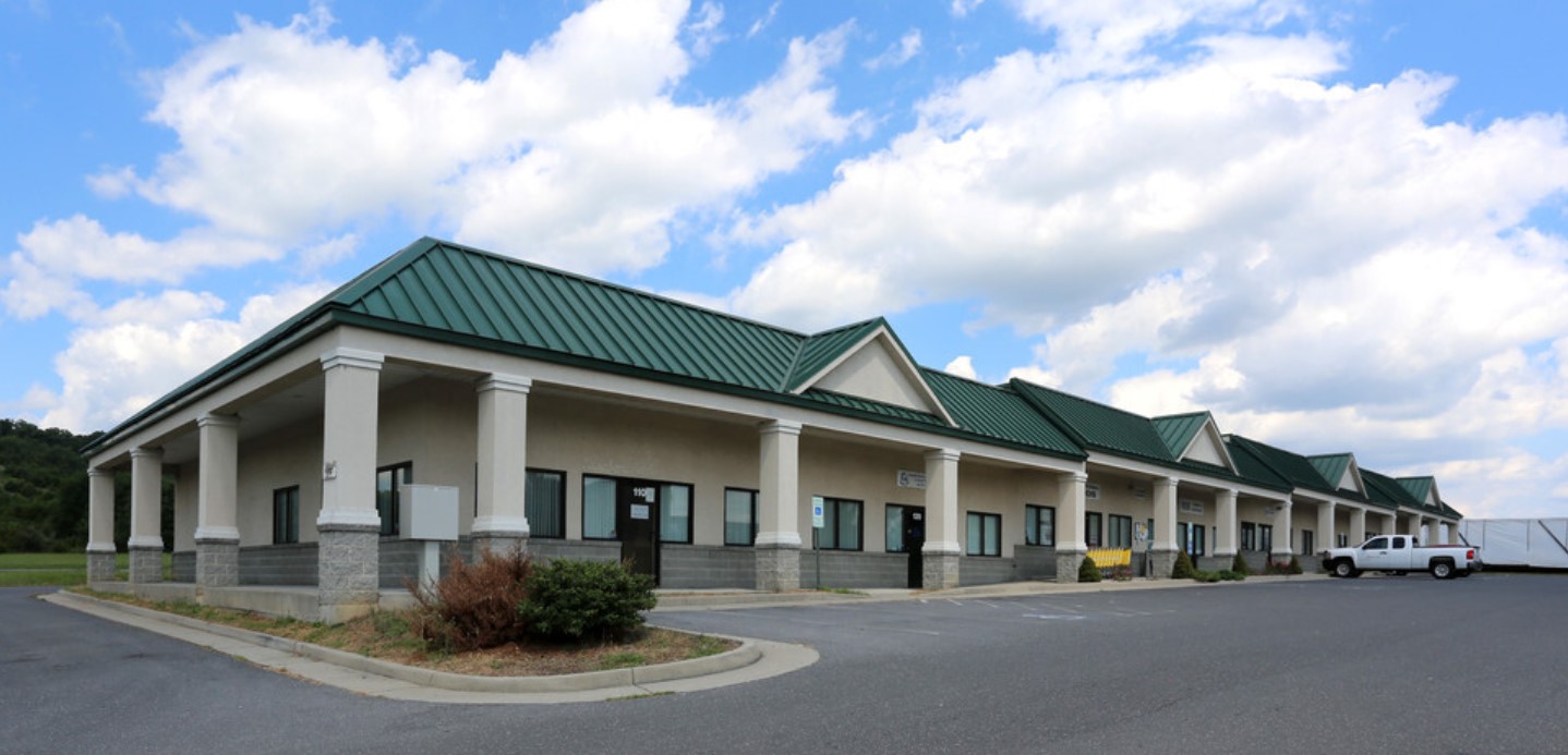 Facility exterior with accessible parking.