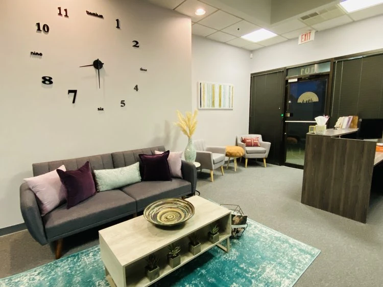 Couch and clock in modern waiting lounge