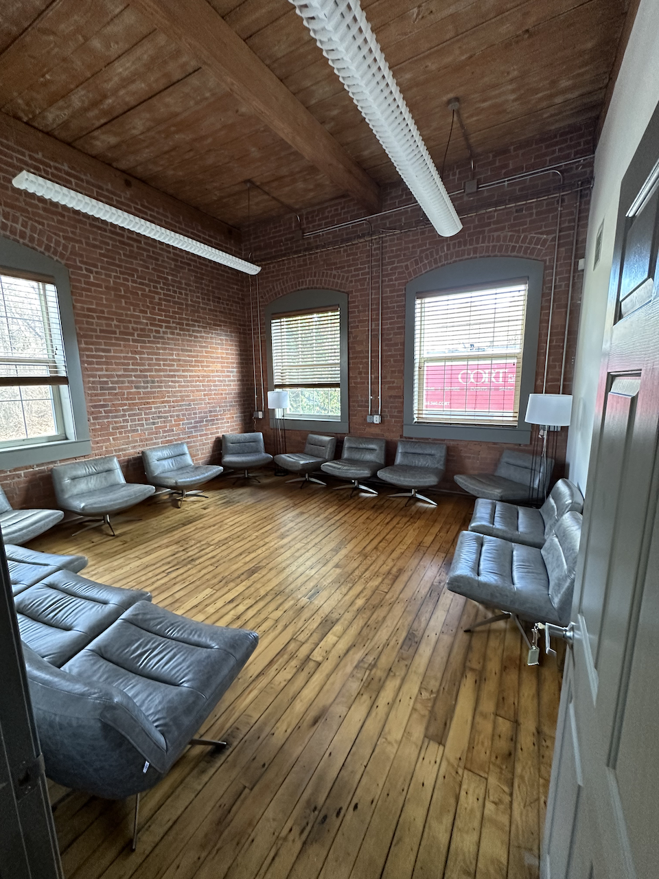 Lounge with gray modern chairs arranged in a circle