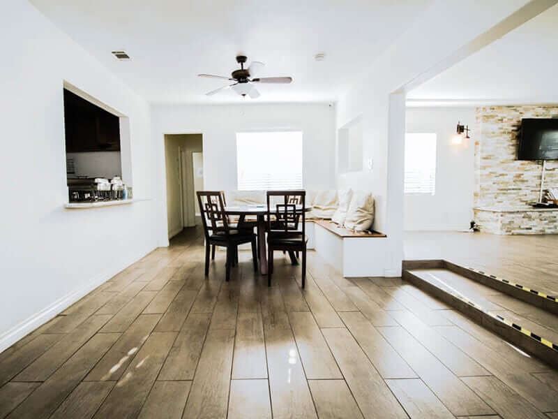 Dining table and chairs in a bright shared space