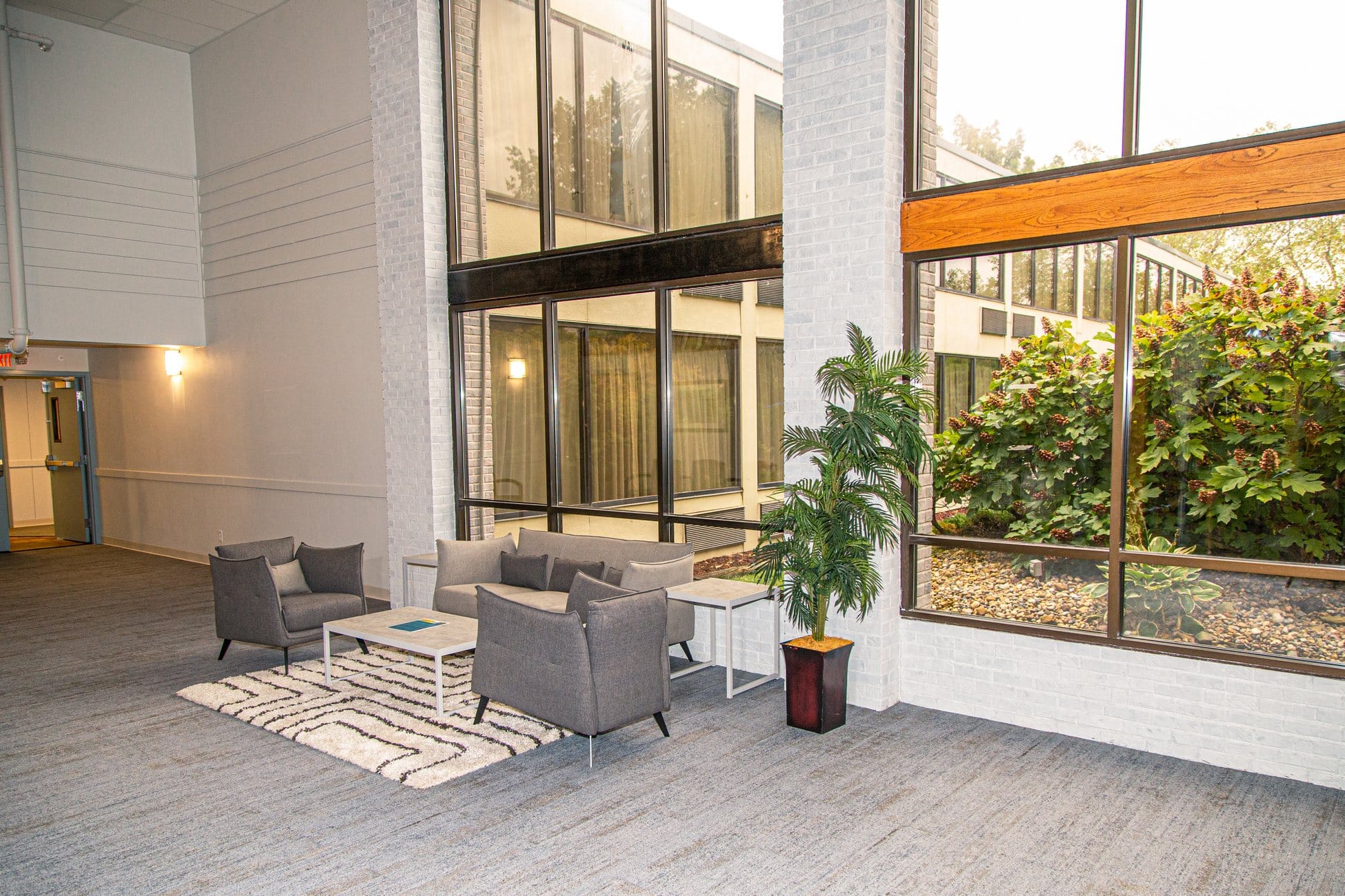 Waiting area with chairs and a table.