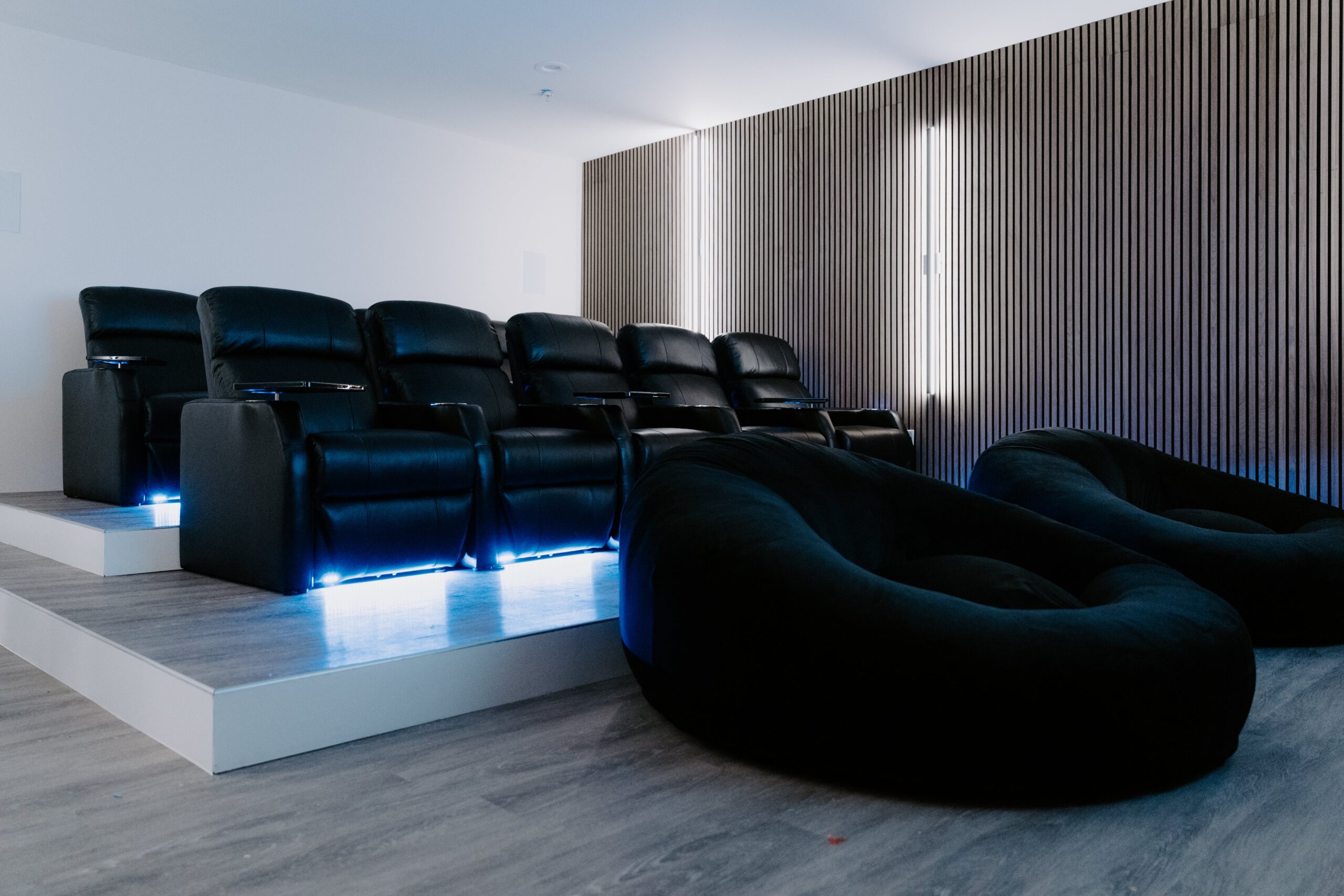 Cinema style area with couches and bean bags in rows