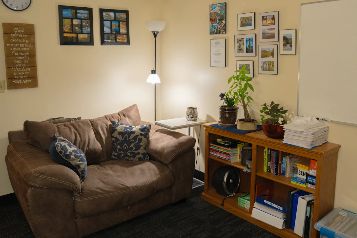 Cozy lounge with sofa, bookshelf, and plants