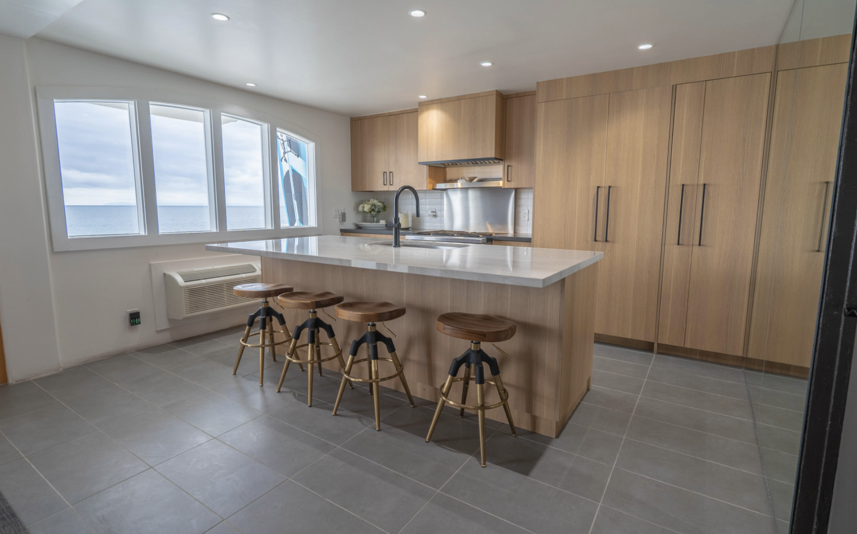 Modern kitchen with island and ocean views