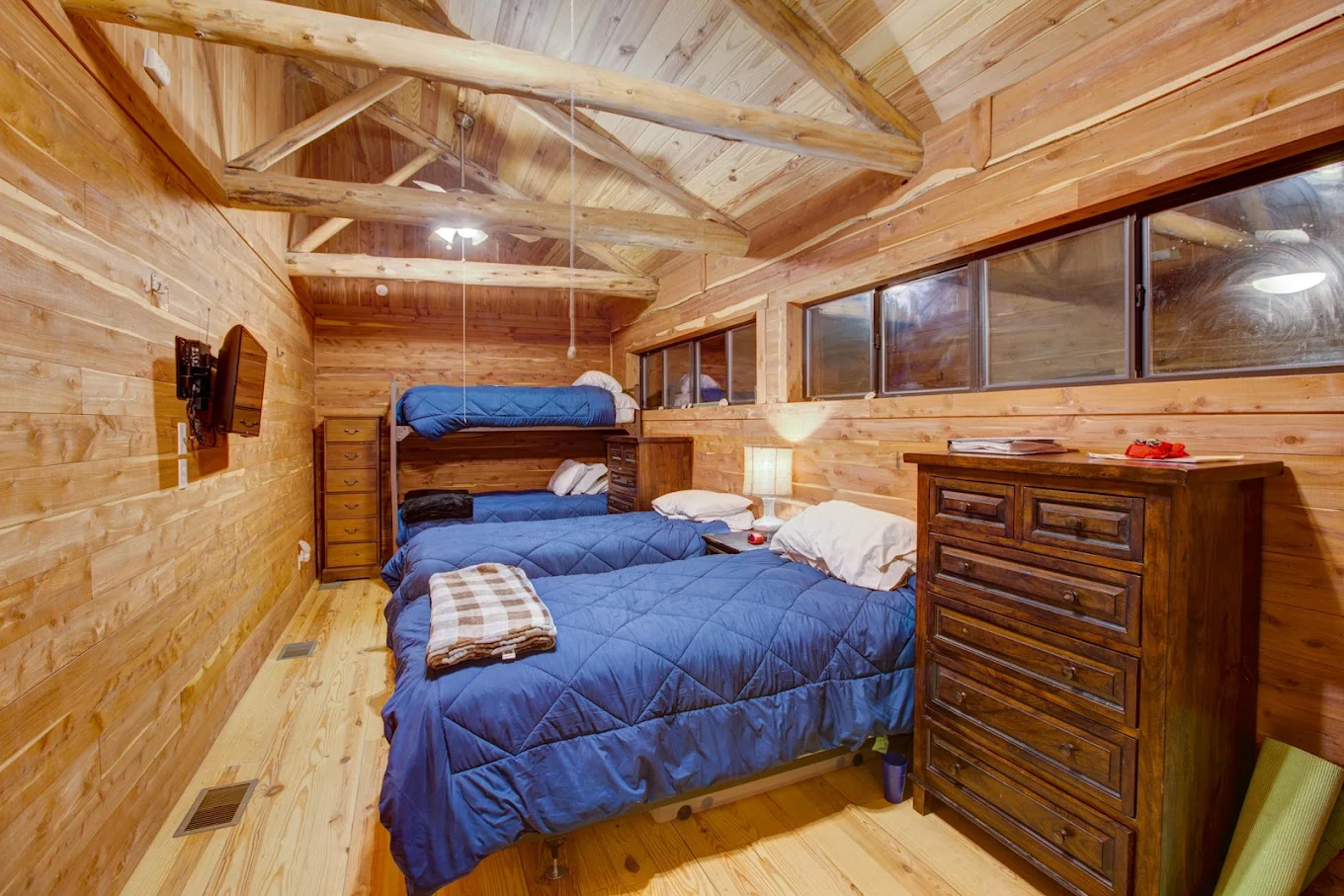 Shared bedroom with bunk beds in a residential cabin