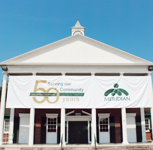Meridian facility exterior with 50th anniversary banner