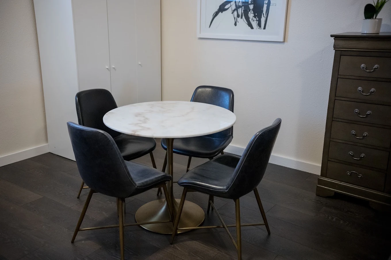 Small meeting area with round table and four chairs