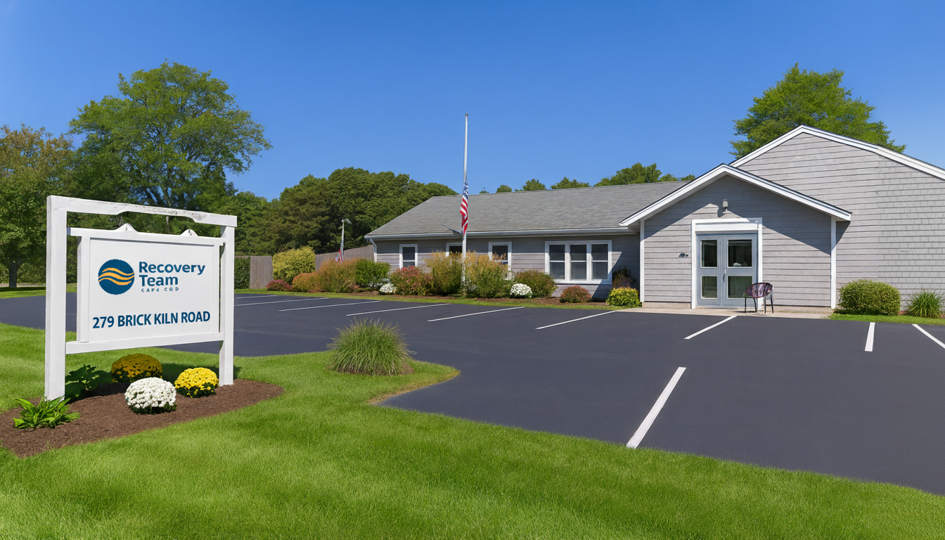 Facility exterior with large roadside sign and parking lot.