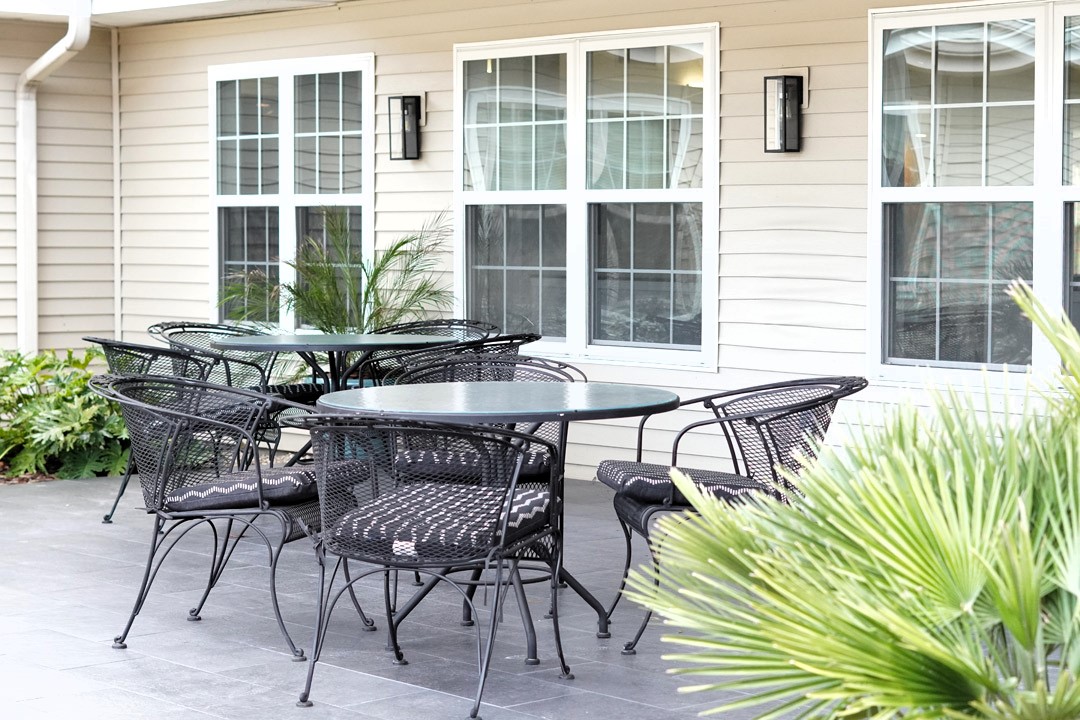 Patio tables and chairs near windows