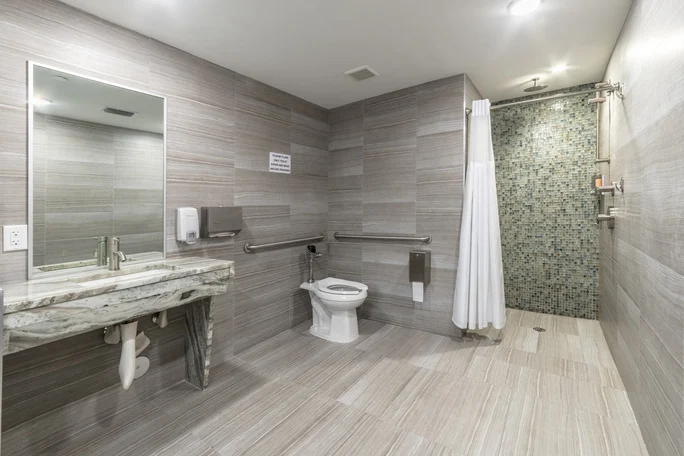 Spacious ADA-compliant bathroom with walk-in shower