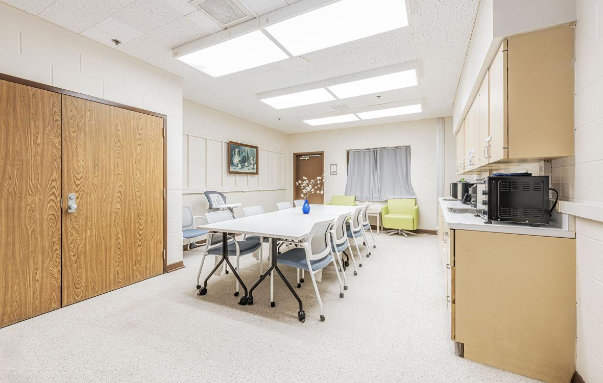 Dining area with table, chairs, and kitchenette