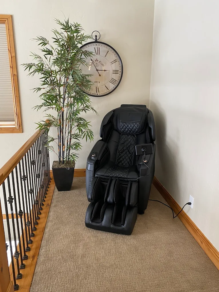 Massage chair in quiet relaxation area near stair railing