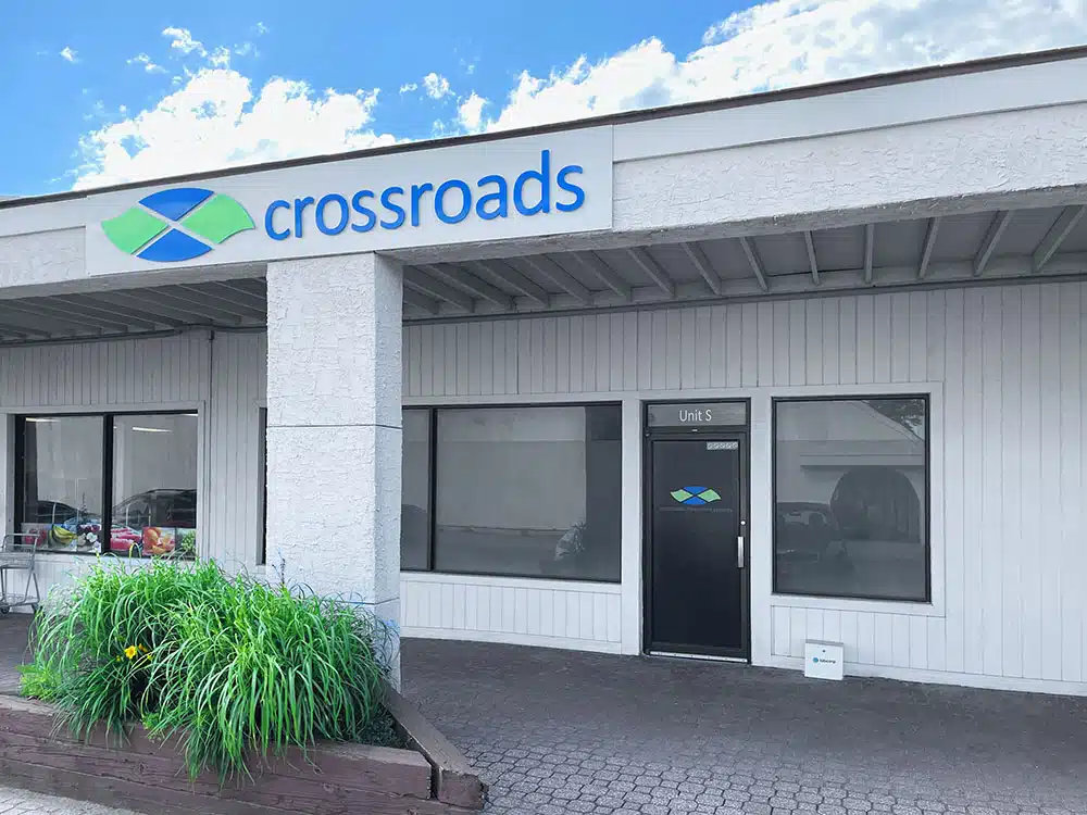 Clinic storefront with Crossroads sign and entry door