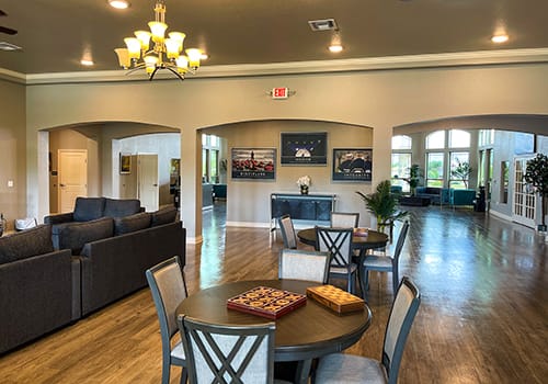 Open lobby area with sofas and tables with games.