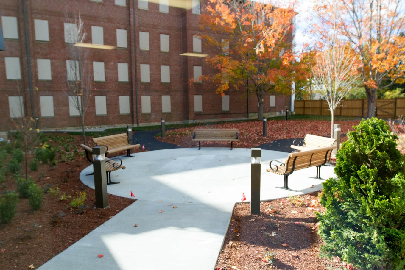 Outdoor circular patio with benches and landscaping